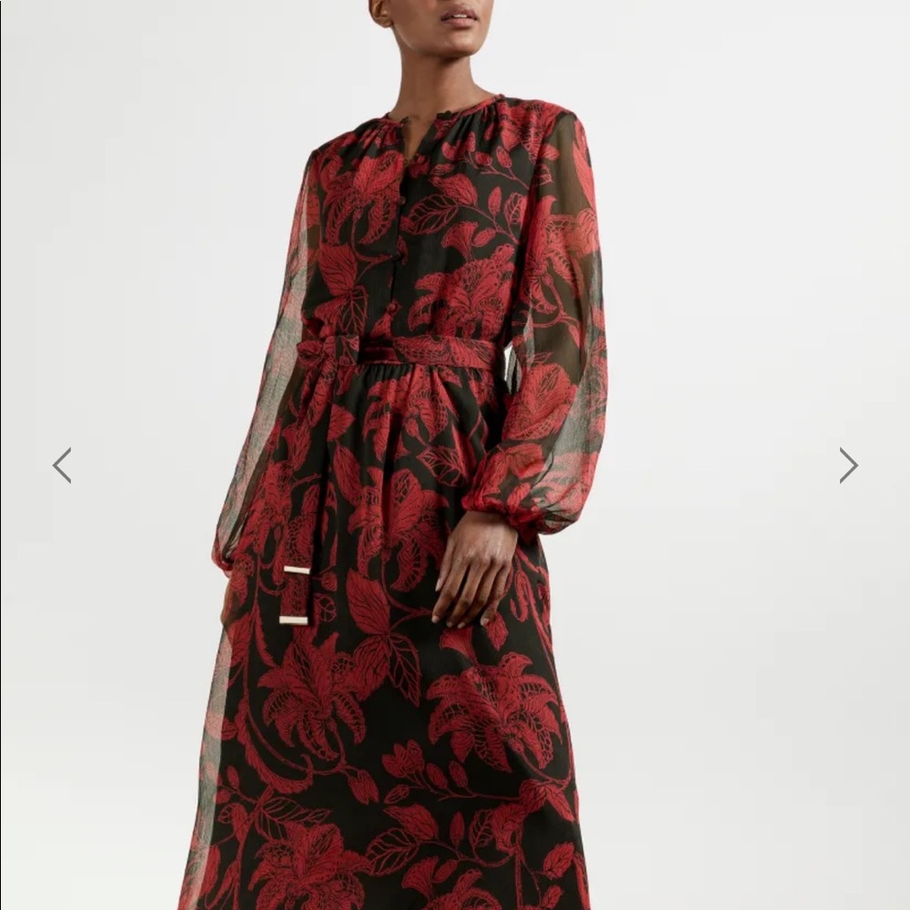 Ted Baker Rococo button down dress in black w/
blouson sleeves.
Midi length